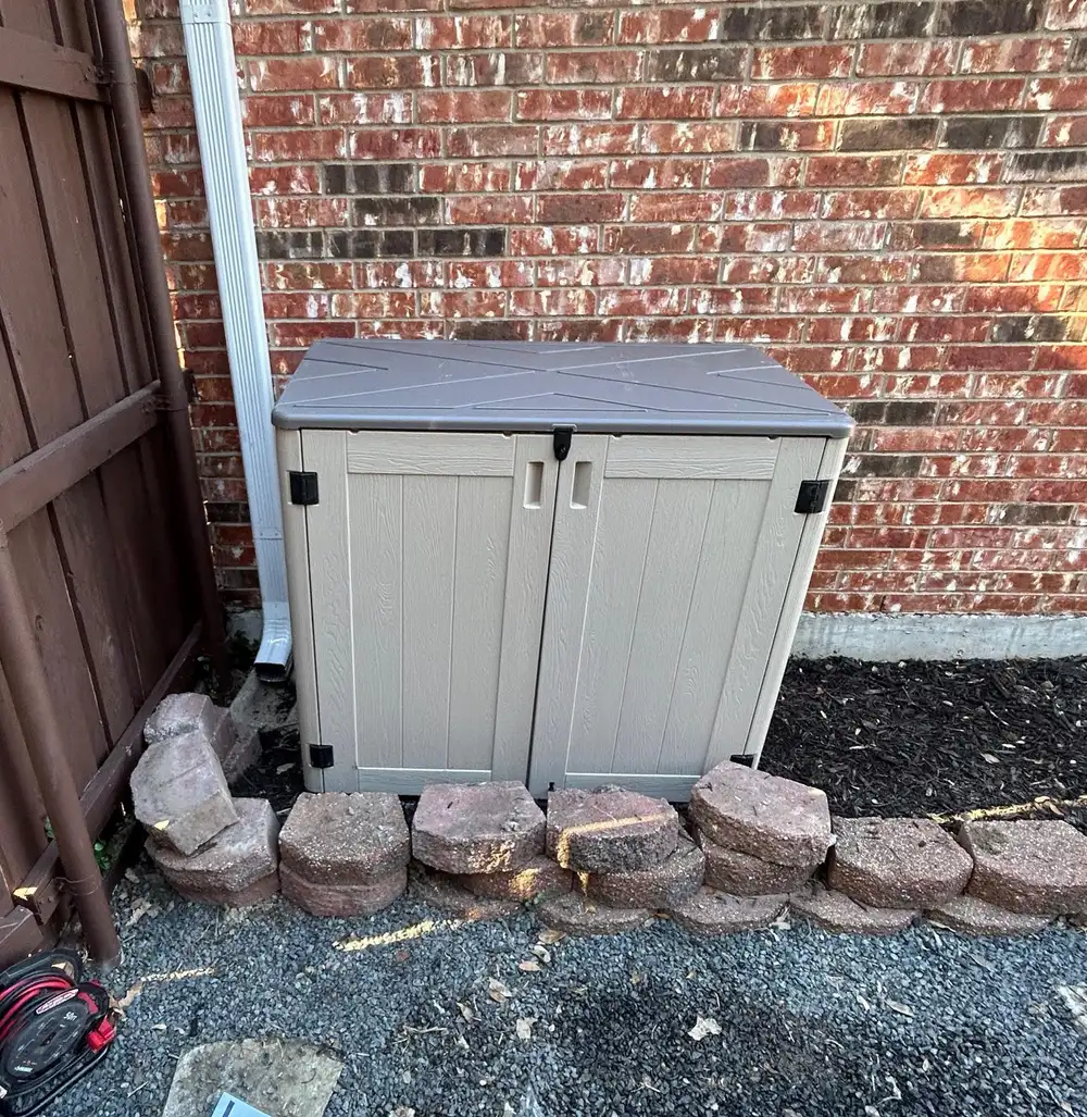 Weatherproof enclosure concealing an outdoor water treatment system